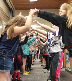 students making arm bridges