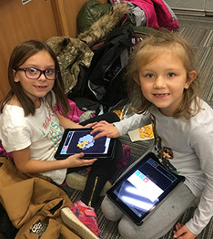 two students with tablets